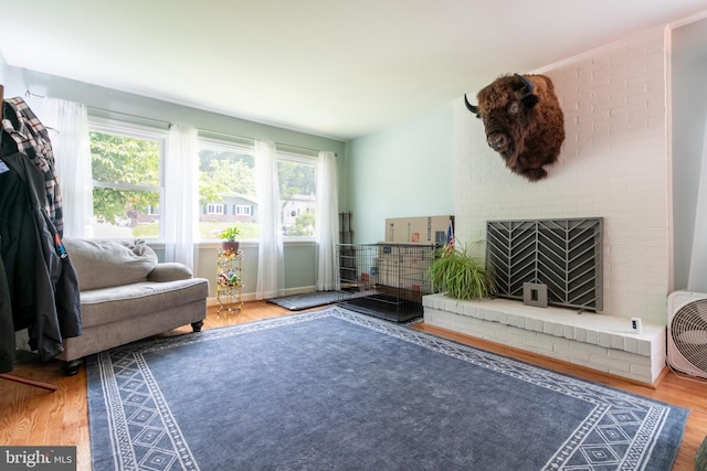 618 Chapelgate Dr, Odenton, MD 21113 - living area featuring wood finished floors and a brick fireplace