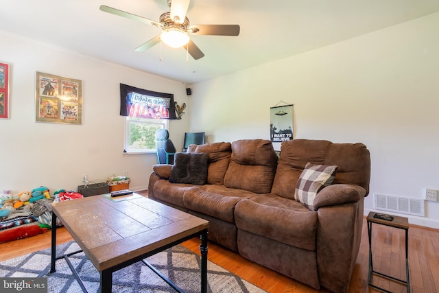618 Chapelgate Dr, Odenton, MD 21113 - living area with light wood-style flooring, a ceiling fan, and baseboards