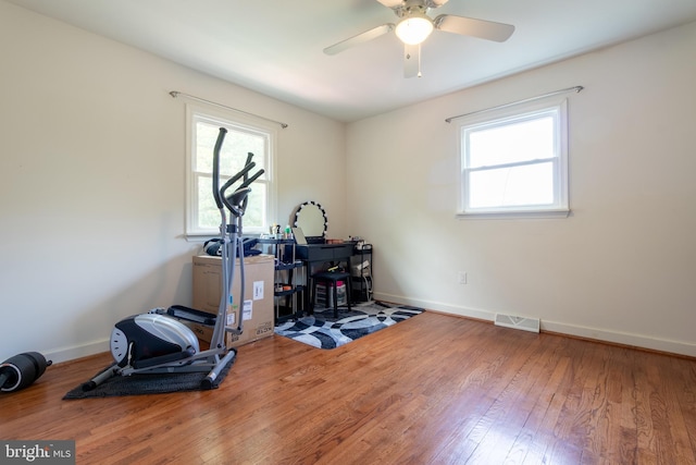 618 Chapelgate Dr, Odenton, MD 21113 - exercise area with healthy amount of natural light, wood finished floors, a ceiling fan, and baseboards