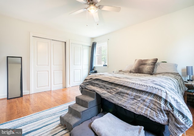 618 Chapelgate Dr, Odenton, MD 21113 - bedroom with multiple closets, wood finished floors, and ceiling fan
