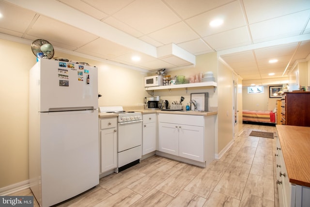 618 Chapelgate Dr, Odenton, MD 21113 - kitchen with white appliances, a sink, a drop ceiling, white cabinets, and recessed lighting