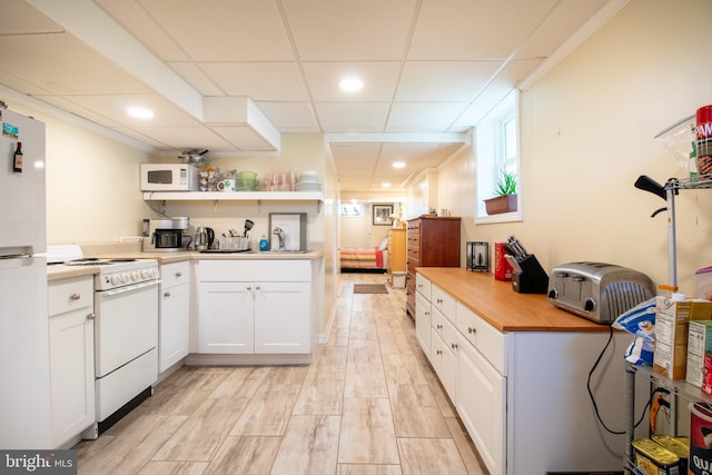 618 Chapelgate Dr, Odenton, MD 21113 - kitchen with white appliances, white cabinets, a drop ceiling, light wood-type flooring, and butcher block counters