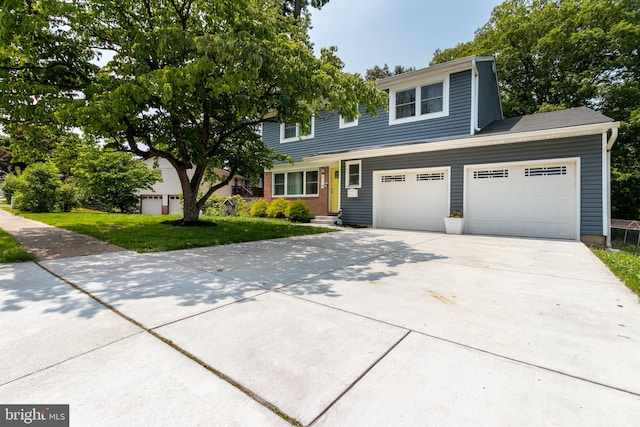 618 Chapelgate Dr, Odenton, MD 21113 - view of front of house featuring driveway, a garage, and a front yard
