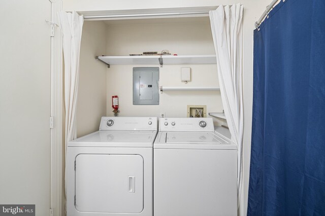 355 Westridge Cir Unit 128, Phoenixville, PA 19460 - clothes washing area with electric panel and separate washer and dryer
