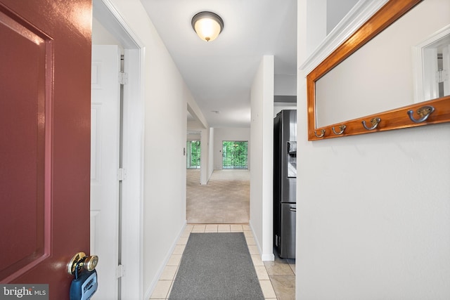 355 Westridge Cir Unit 128, Phoenixville, PA 19460 - corridor with light tile patterned floors, light carpet, and baseboards