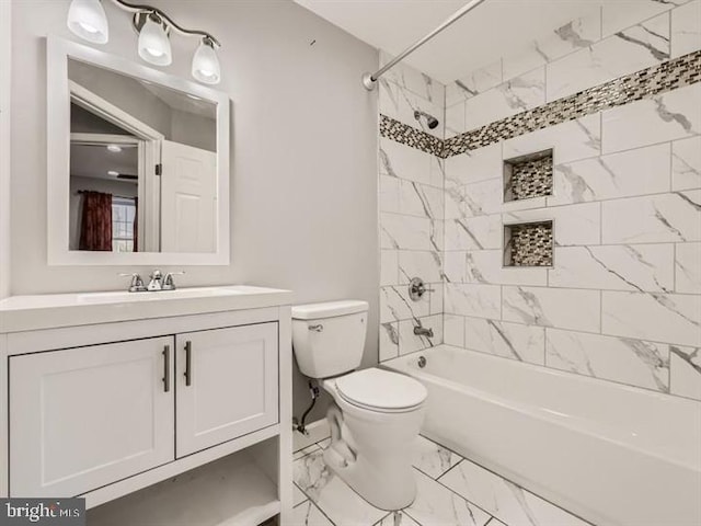 905 E Patapsco Ave, Baltimore, MD 21225 - full bathroom featuring marble look tiles, toilet, vanity, and bathing tub / shower combination