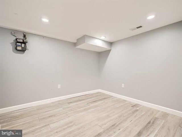 905 E Patapsco Ave, Baltimore, MD 21225 - finished below grade area featuring light wood-type flooring, baseboards, recessed lighting, and gas meter