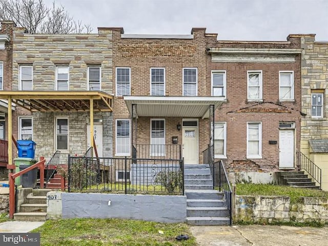 905 E Patapsco Ave, Baltimore, MD 21225 - townhome / multi-family property featuring entry steps and brick siding