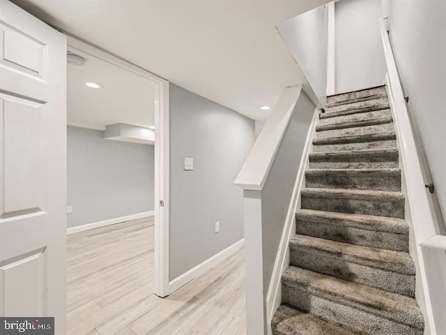 905 E Patapsco Ave, Baltimore, MD 21225 - stairs with wood finished floors, baseboards, and recessed lighting