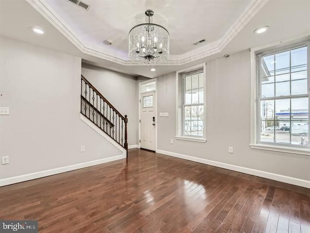 905 E Patapsco Ave, Baltimore, MD 21225 - entryway with a tray ceiling, a chandelier, crown molding, hardwood / wood-style flooring, and baseboards