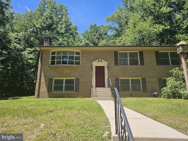 11009 Valley Brook Dr, Fort Washington, MD 20744 - raised ranch with a front yard, a chimney, and brick siding
