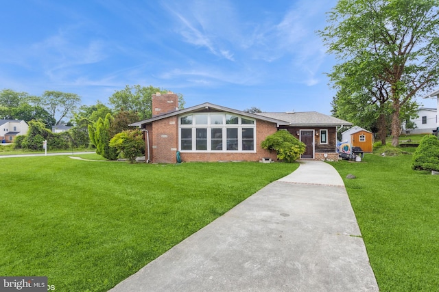 2400 Willow Glen Dr, Baltimore, MD 21209 - view of front of property featuring a chimney, brick siding, and a front lawn