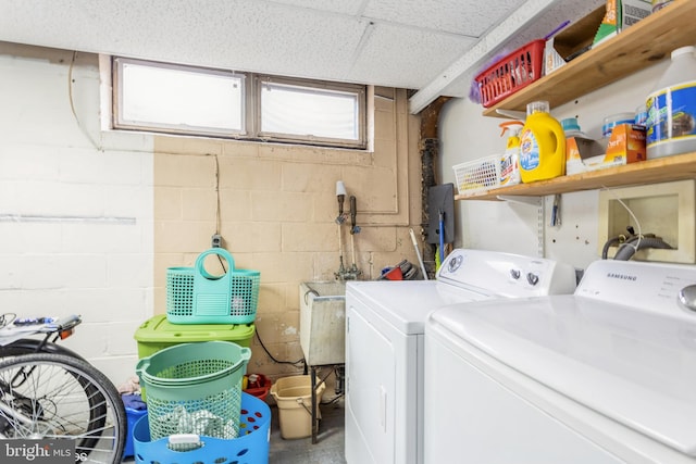 2400 Willow Glen Dr, Baltimore, MD 21209 - washroom with washing machine and dryer and concrete block wall