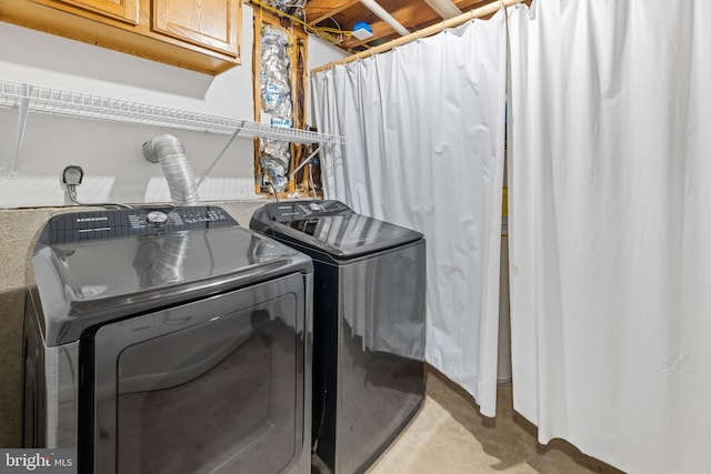 9761 Turnbuckle Dr, Burke, VA 22015 - laundry room featuring washing machine and clothes dryer and cabinet space