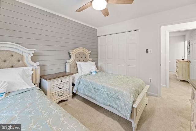 9761 Turnbuckle Dr, Burke, VA 22015 - bedroom featuring light colored carpet, a closet, baseboards, ceiling fan, and wood walls
