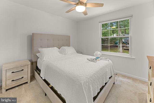 9761 Turnbuckle Dr, Burke, VA 22015 - bedroom with light colored carpet, baseboards, and a ceiling fan