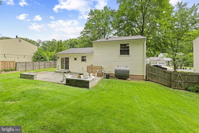 9761 Turnbuckle Dr, Burke, VA 22015 - back of property featuring heating fuel, a patio, and a shingled roof