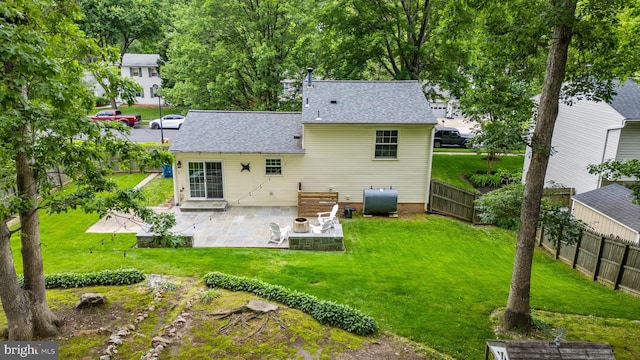 9761 Turnbuckle Dr, Burke, VA 22015 - rear view of house with a patio area and roof with shingles