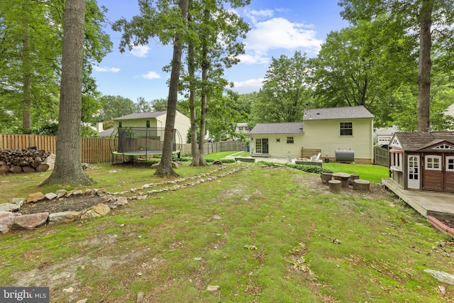 9761 Turnbuckle Dr, Burke, VA 22015 - view of yard with a trampoline