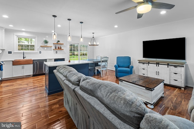 9761 Turnbuckle Dr, Burke, VA 22015 - living area featuring recessed lighting, ceiling fan, wood finished floors, ornamental molding, and a chandelier