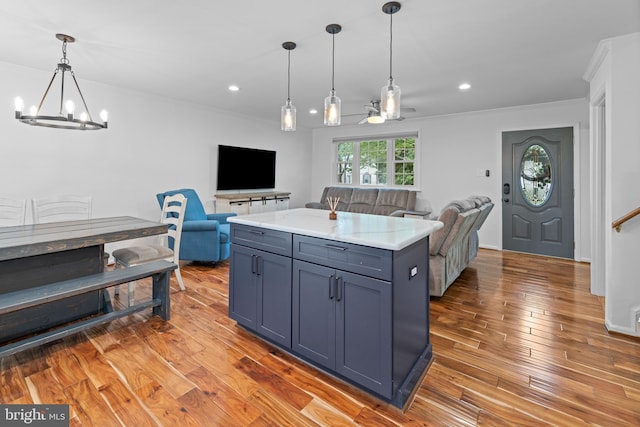 9761 Turnbuckle Dr, Burke, VA 22015 - kitchen with open floor plan, a chandelier, crown molding, light wood-type flooring, and recessed lighting