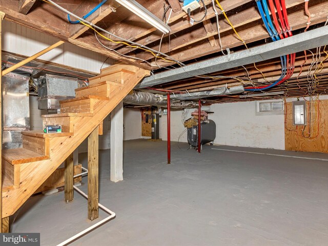 510 E Main St, Emmitsburg, MD 21727 - below grade area featuring oil tank, electric panel, stairs, and water heater