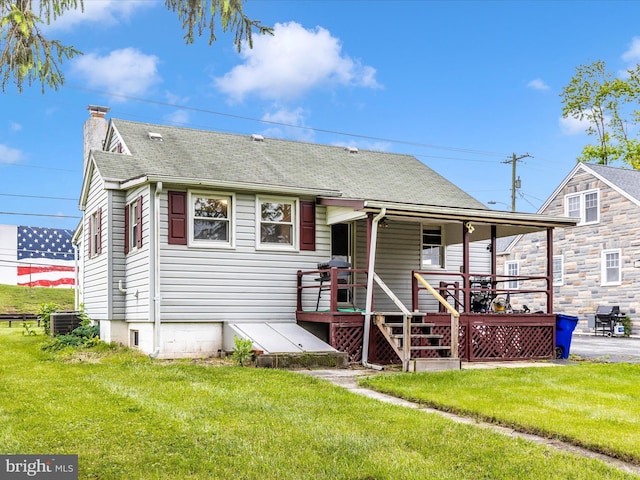 510 E Main St, Emmitsburg, MD 21727 - view of front facade featuring a chimney, roof with shingles, a front lawn, central air condition unit, and covered porch