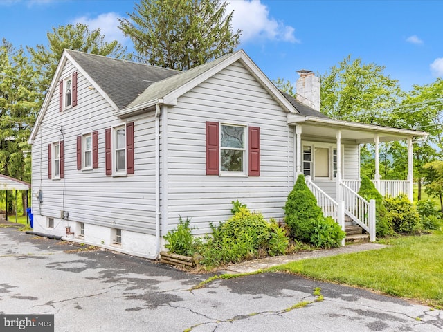 510 E Main St, Emmitsburg, MD 21727 - view of front facade with a chimney and roof with shingles