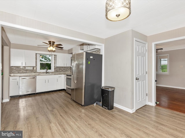 510 E Main St, Emmitsburg, MD 21727 - kitchen with appliances with stainless steel finishes, a sink, light wood finished floors, a ceiling fan, and light countertops