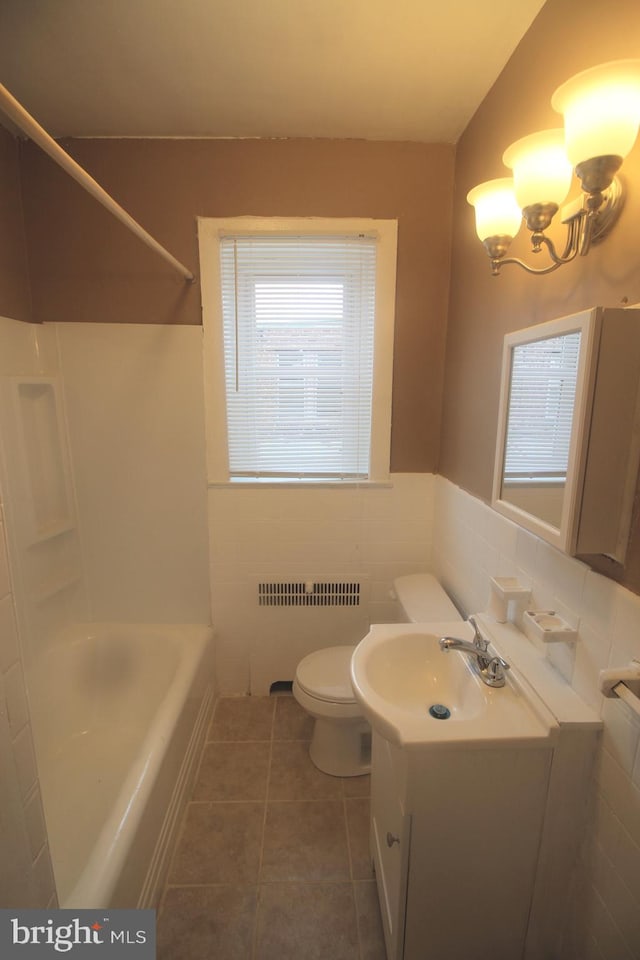 1826 N 52nd St, Philadelphia, PA 19131 - full bathroom featuring radiator, vanity, toilet, tile walls, and tile patterned floors
