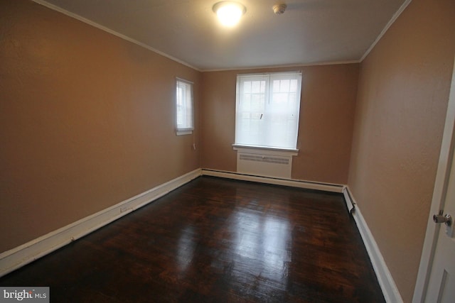 1826 N 52nd St, Philadelphia, PA 19131 - spare room featuring a baseboard heating unit, a smoke detector, baseboards, wood finished floors, and crown molding