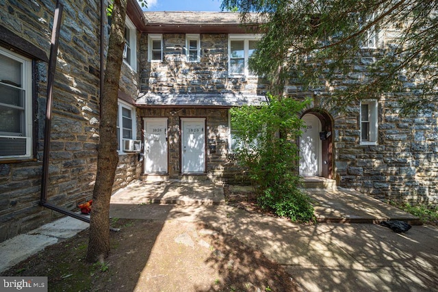 1826 N 52nd St, Philadelphia, PA 19131 - view of property with stone siding and cooling unit