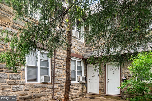 1826 N 52nd St, Philadelphia, PA 19131 - property entrance with stone siding and cooling unit