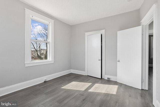 3532 Lucille Ave, Baltimore, MD 21215 - unfurnished bedroom with wood finished floors and baseboards