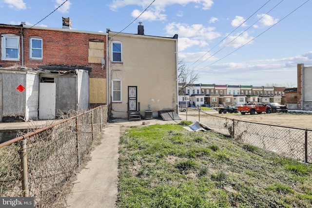 3532 Lucille Ave, Baltimore, MD 21215 - back of house with fence, entry steps, a residential view, and central AC unit