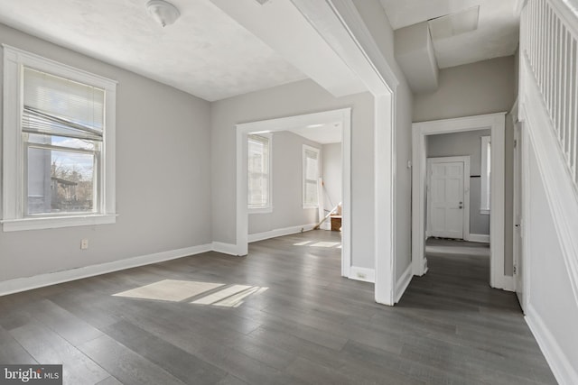 3532 Lucille Ave, Baltimore, MD 21215 - unfurnished bedroom with multiple windows, wood finished floors, and baseboards