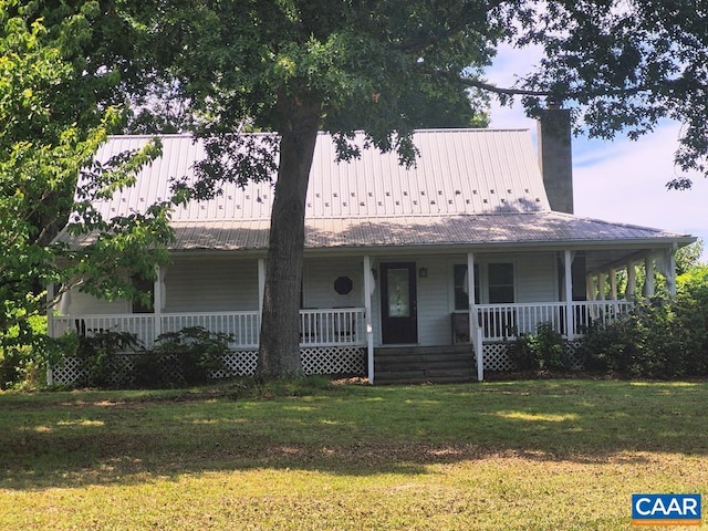 566 Holman Mill Rd, Farmville, VA 23901 - farmhouse featuring a porch, a chimney, a front yard, and metal roof