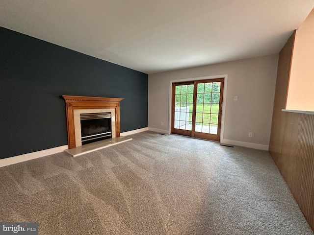 215 Bridge Rd, Upper Chichester, PA 19061 - unfurnished living room featuring a high end fireplace, carpet, and baseboards
