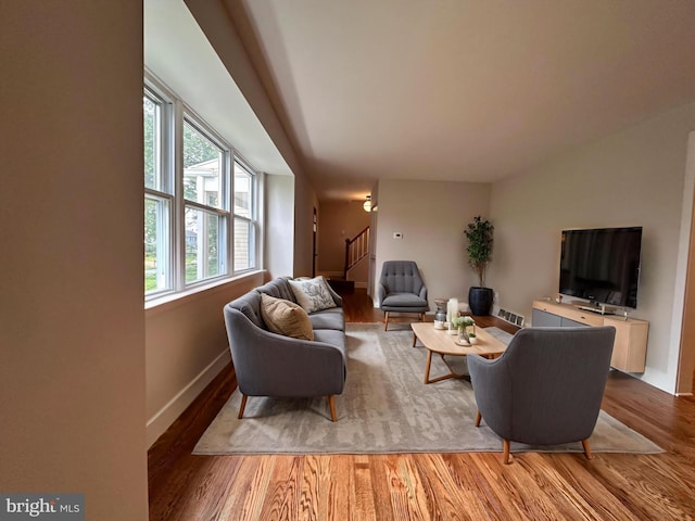 215 Bridge Rd, Upper Chichester, PA 19061 - living room featuring wood finished floors, stairway, and baseboards
