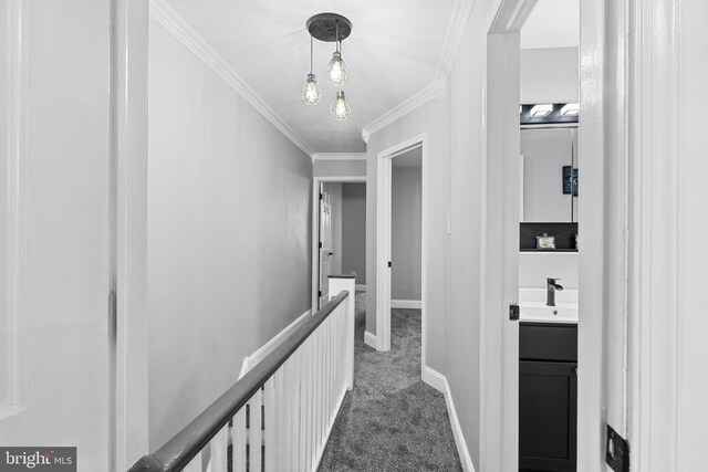 3342 Belgrade St, Philadelphia, PA 19134 - hall featuring an upstairs landing, dark colored carpet, baseboards, crown molding, and a sink