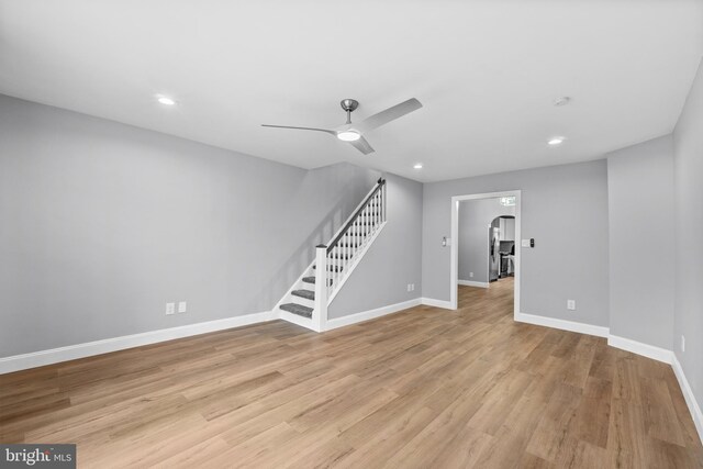 3342 Belgrade St, Philadelphia, PA 19134 - unfurnished living room with arched walkways, a ceiling fan, stairway, light wood-style flooring, and recessed lighting