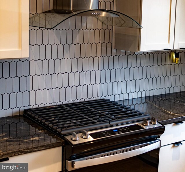 3342 Belgrade St, Philadelphia, PA 19134 - kitchen view of stainless steel gas stove, white cabinetry, decorative backsplash, and ventilation hood