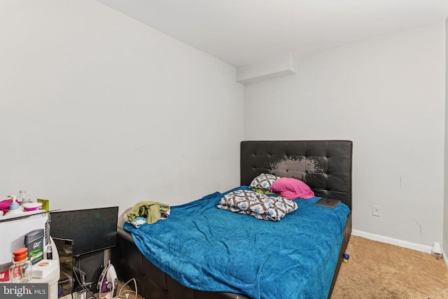 bedroom with carpet and baseboards