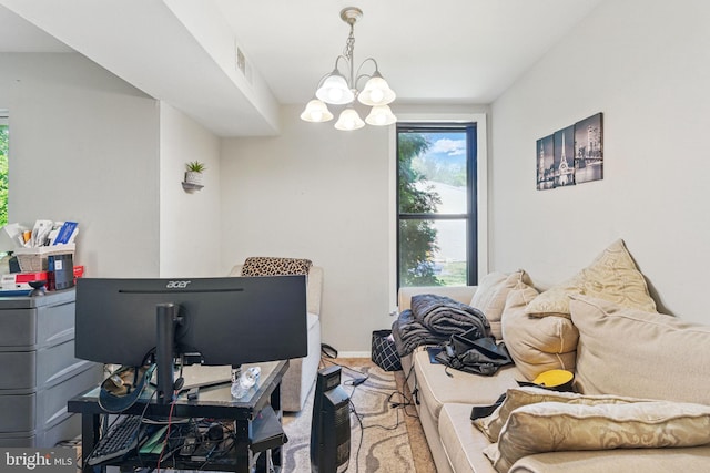 home office with a chandelier and baseboards