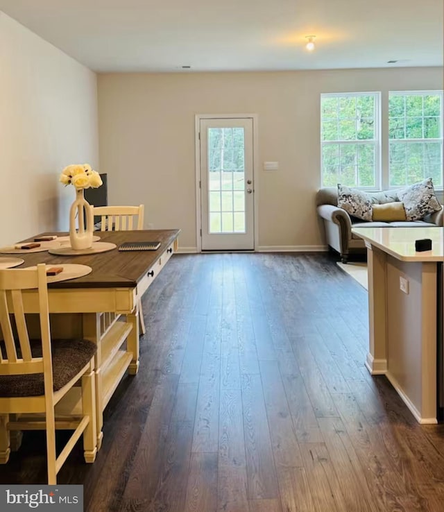 166 Sickler Ct, Sicklerville, NJ 08081 - dining area with dark wood-style floors and baseboards