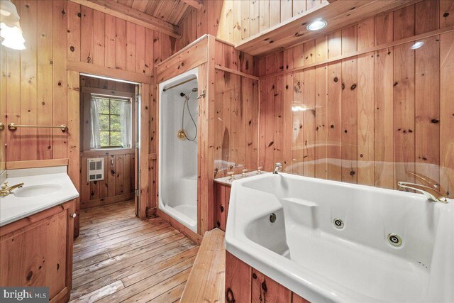 21142 Westerly Rd, Poolesville, MD 20837 - bathroom with hardwood / wood-style floors, wood walls, a shower stall, a jetted tub, and vanity