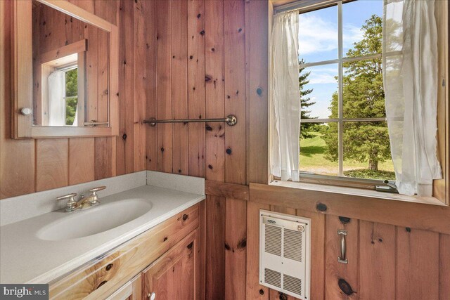 21142 Westerly Rd, Poolesville, MD 20837 - bathroom with wooden walls, vanity, healthy amount of natural light, and heating unit
