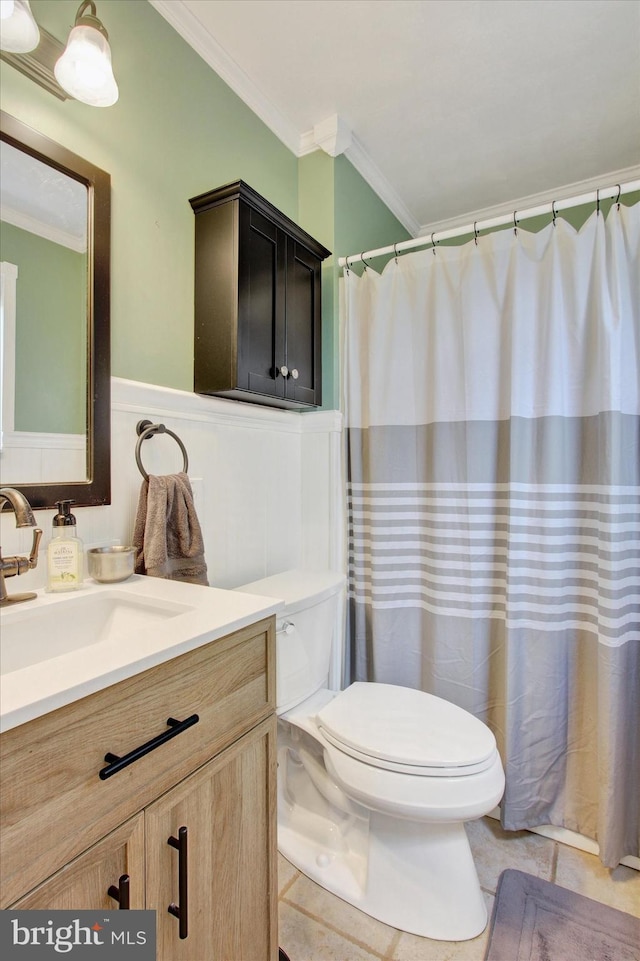 325 Jasmine Dr, Hanover, PA 17331 - bathroom with crown molding, toilet, vanity, wainscoting, and tile patterned floors