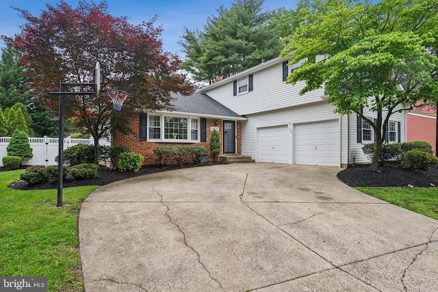 520 Perry Dr, Mount Laurel, NJ 08054 - traditional home with driveway, brick siding, and a garage