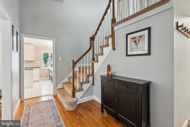 520 Perry Dr, Mount Laurel, NJ 08054 - entryway featuring light wood finished floors, stairs, baseboards, and a towering ceiling